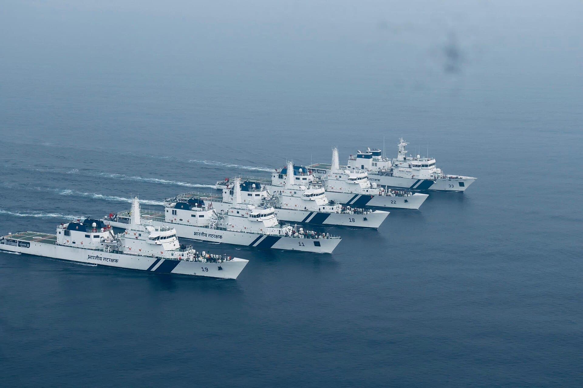 Indian Coast Guard ships sailing in formation during an exercise